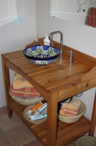 Upstairs Bathroom cedar potting bench turned vanity with a talavera vessel sink from Mexico