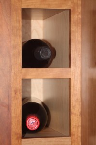 Some of the wine cubbies in our Kitchen cabinetry (natural solid cherry)