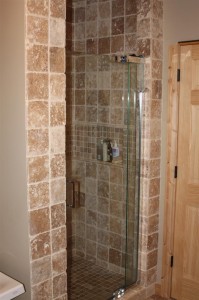 Master Bath travertine stall shower with Kohler Purist line door and fixture